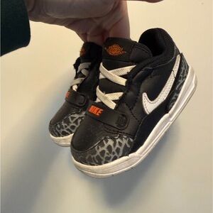 Nike Jordan Toddler Black & White Sneaker with Orange Accents size 6c